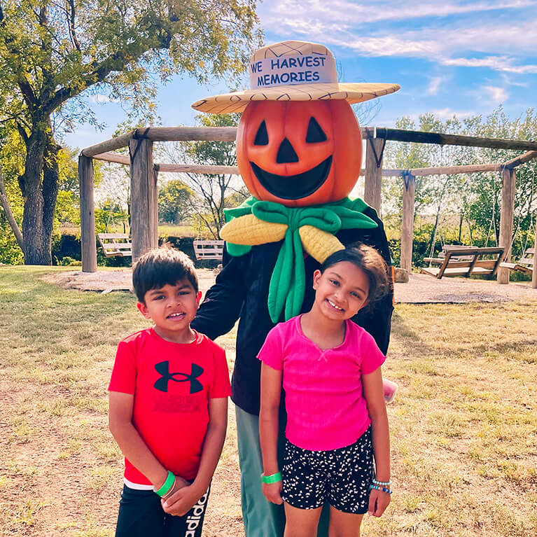 767x767-MascotWith2Kids