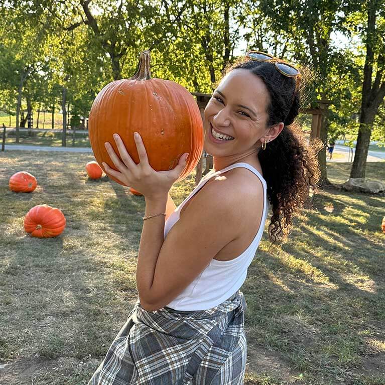 767x767-YoungWomanHoldingPumpkin